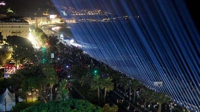 Eighty-six lights were displayed at night over the Promenade des Anglais in Nice, southeastern France to mark the 5th anniversary of a jihadist truck attack where a man drove a 19-tonne truck six years ago into a crowd, killing 86 people. (Photo by Nicolas TUCAT/AFP)