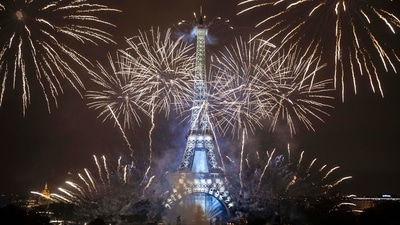 Fireworks illuminate the Eiffel Tower in Paris as France celebrated its national holiday with thousands of troops marching in a Paris parade and traditional parties around the country. (AP/PTI )