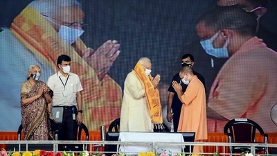 Prime Minister Narendra Modi, UP Chief Minister Yogi Adityanath and state Governor Anandiben Patel during the inauguration of various developmental projects, at BHU Ground in Varanasi. (PTI)