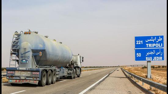 A fuel tanker truck drives along the international highway linking Tunisia’s southern town of Ben Guerdane to Libya. (AFP)