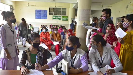 Doctors running a parallel OPD at a common hall in civil hospital, Ludhiana, on Thursday. (Gurpreet Singh/HT)