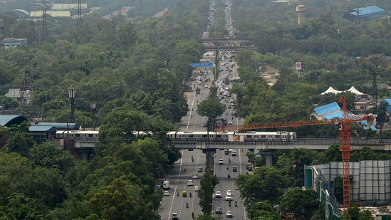 An aerial view of a Delhi Metro train running on a track over the Ring Road. (PTI Photo)