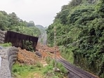 The landslide triggered by heavy rains brought down a portion of the retaining wall too thereby blocking the track.(ANI) The landslide triggered by heavy rains brought down a portion of the retaining wall too thereby blocking the track.(ANI)