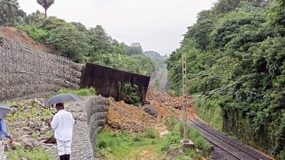 The landslide triggered by heavy rains brought down a portion of the retaining wall too thereby blocking the track. (ANI) The landslide triggered by heavy rains brought down a portion of the retaining wall too thereby blocking the track. (ANI)
