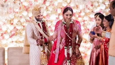 Disha Parmar's stunning lehenga was from ace designer duo Abu Jani and Sandeep Khosla's Dancing Peacock collection and Rahul Vaidya was also wearing a piece from the designer's Asal collection. (Instagram/IsraniPhotography) Disha Parmar's stunning lehenga was from ace designer duo Abu Jani and Sandeep Khosla's Dancing Peacock collection and Rahul Vaidya was also wearing a piece from the designer's Asal collection. (Instagram/IsraniPhotography)