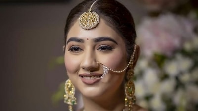 Along with this she also wore a large nath in her nose and huge stacks of bangles, a mix of red and gold to complete her bridal look. Given her heavy outfit and jewellery, Disha opted for a subtle nude make-up look to glam up for her wedding day. (Instagram/IsraniPhotography) Along with this she also wore a large nath in her nose and huge stacks of bangles, a mix of red and gold to complete her bridal look. Given her heavy outfit and jewellery, Disha opted for a subtle nude make-up look to glam up for her wedding day. (Instagram/IsraniPhotography)