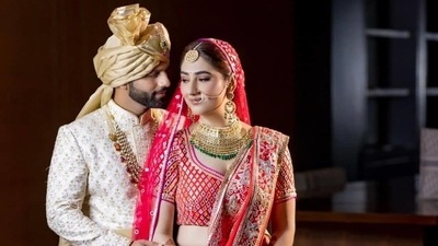Disha wore a 'ravishing red ghagra' and a circular head dupatta in a bright pink shade which had beautiful abla embroidery over it. Also features was the 'gath joda with gold detailing'. (Instagram/IsraniPhotography) Disha wore a 'ravishing red ghagra' and a circular head dupatta in a bright pink shade which had beautiful abla embroidery over it. Also features was the 'gath joda with gold detailing'. (Instagram/IsraniPhotography)