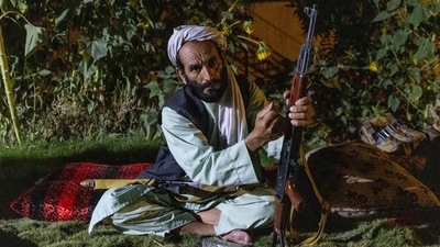 A militiaman loads his rifle as Afghan Special Forces visit a district centre during a combat mission against Taliban, in Kandahar province, Afghanistan on July 12. (Danish Siddiqui / REUTERS)
