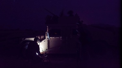 A member of the Afghan Special Forces keeps a watch as others search houses in a village during a combat mission against Taliban, in Kandahar province, Afghanistan on July 12. Siddiqui was part of a Reuters team that had won a Pulitzer Prize in 2018 for its coverage of Rohingya refugees in Bangladesh. (Danish Siddiqui / REUTERS)