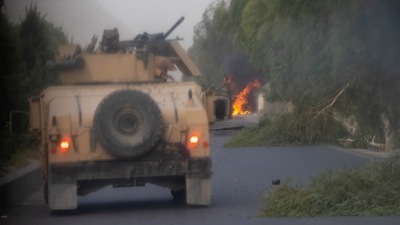 Humvees belonging to Afghan Special Forces are seen destroyed during heavy clashes with Taliban during the rescue mission of a police officer besieged at a check post, in Kandahar province, Afghanistan, on July 13. (Danish Siddiqui / REUTERS)
