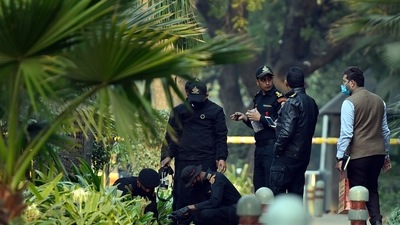 The National Security Guard (NSG) team seen collecting a sample during an investigation at the site of the blast near the Israel Embassy, in New Delhi. (Sanjeev Verma /HT Archive)