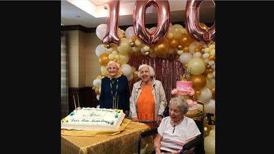 The image shows the three women celebrating their birthdays. (@AtriaSeniorLiving)