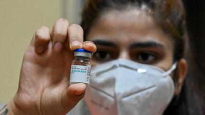 A health worker displays a vial of the Covaxin vaccine at a health centre in New Dehi on July 15, 2021. (AFP) A health worker displays a vial of the Covaxin vaccine at a health centre in New Dehi on July 15, 2021. (AFP)
