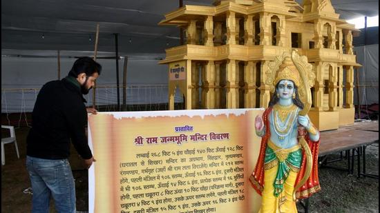 A VHP activist stands near a replica of Ram Mandir in Prayagraj. (ANI File)