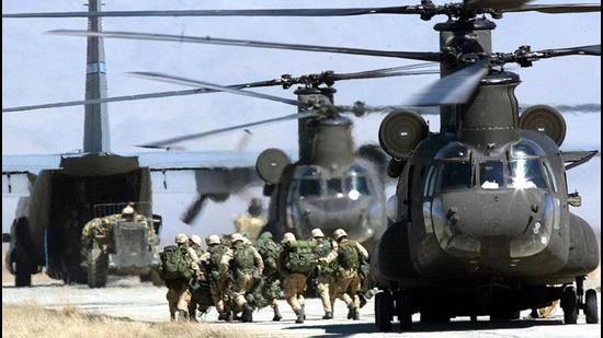 In this file photo taken on March 12, 2002, US soldiers disembark from a CH-46 Chinook helicopter at Bagram Air Base. (AFP) In this file photo taken on March 12, 2002, US soldiers disembark from a CH-46 Chinook helicopter at Bagram Air Base. (AFP)