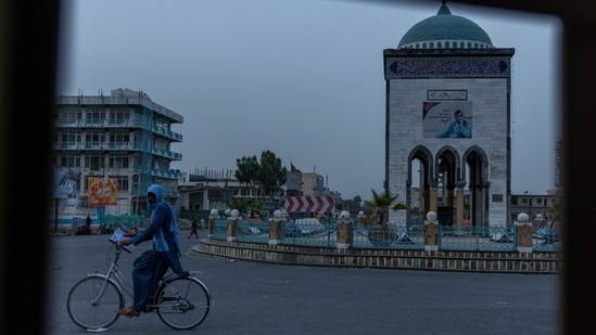A convoy of Afghan Special Forces passes through a public square early morning during the rescue mission of a police officer besieged at a check post surrounded by Taliban, in Kandahar province, Afghanistan on July 13. Siddiqui also won praise for his images of communal violence in northeast Delhi in 2020 and the devastating second wave of Covid-19 infections earlier this year.(Danish Siddiqui / REUTERS)