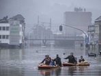 People use rubber rafts in floodwaters after the Meuse River broke its banks during heavy flooding in Liege, Belgium on July 15. Torrential rain turned normally placid rivers into raging torrents in parts of Germany, Belgium and the Netherlands this week, dragging cars and roads with them, bringing down whole houses and leaving more than 150 people dead.(Valentin Bianchi / AP Photo) People use rubber rafts in floodwaters after the Meuse River broke its banks during heavy flooding in Liege, Belgium on July 15. Torrential rain turned normally placid rivers into raging torrents in parts of Germany, Belgium and the Netherlands this week, dragging cars and roads with them, bringing down whole houses and leaving more than 150 people dead.(Valentin Bianchi / AP Photo)