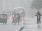 A motorist trying to start a stalled motorcycle on NH24 during heavy rain in New Delhi,(Raj K Raj / Hindustan Times) A motorist trying to start a stalled motorcycle on NH24 during heavy rain in New Delhi,(Raj K Raj / Hindustan Times)