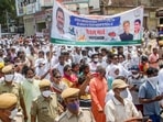 Congress Party activists take out a march as they protest against the hike in fuel and LPG prices, in Jaipur on July 17, 2021. 