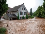 Houses are submerged on the overflowed river banks in Erdorf, Germany, as the village was flooded on Thursday, July 15, 2021. (AP) Houses are submerged on the overflowed river banks in Erdorf, Germany, as the village was flooded on Thursday, July 15, 2021. (AP)