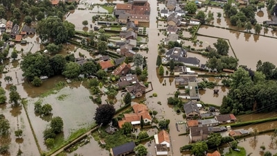An aerial of in Brommelen on July 16 shows the flooded area around the Meuse River in Belgium after a levee of the Juliana Canal broke. Western Germany has suffered the most brutal impact of the deluge that also pummeled Belgium, Luxembourg and the Netherlands, leaving streets and homes submerged in muddy water and isolating entire communities. (Remko de Waal / ANP / AFP)