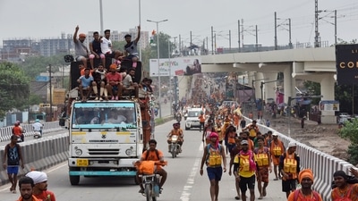 Kanwariyas carrying water from the Ganga River during the Kanwar Yatra in this file picture from 2019 ( Sanjeev Verma/ Hindustan Times)