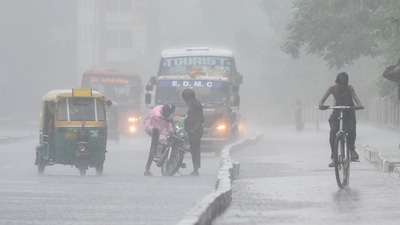 A motorist trying to start a stalled motorcycle on NH24 during heavy rain in New Delhi, (Raj K Raj / Hindustan Times) A motorist trying to start a stalled motorcycle on NH24 during heavy rain in New Delhi, (Raj K Raj / Hindustan Times)