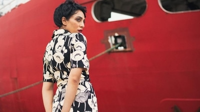 For her look, Sobhita opted for minimal make-up save for her deep red lip, which went perfectly with the aesthetic of her surroundings as well as her outfit, and her bright blue bag stood out in the otherwise black, white and red elements. (Instagram)