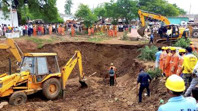 People look on during a rescue operation after several people fell into a well during the rescue of a girl who had fallen into it, at Lal Patthar in MP’s Vidisha district. (PTI Photo) People look on during a rescue operation after several people fell into a well during the rescue of a girl who had fallen into it, at Lal Patthar in MP’s Vidisha district. (PTI Photo)