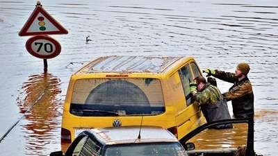 Soldiers of the German armed forces Bundeswehr search for flood victims in submerged vehicles on the federal highway B265 in Erftstadt, western Germany. (AFP) Soldiers of the German armed forces Bundeswehr search for flood victims in submerged vehicles on the federal highway B265 in Erftstadt, western Germany. (AFP)