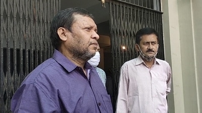 Bihar's senior IAS officer Sudhir Kumar waits in the SC-ST police station at Gardanibagh, in Patna (PTI)