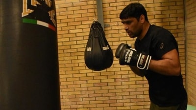 Boxer Manish Kaushik trains in all-black attire in Assisi, Italy ahead of the Indian team's departure for the Tokyo Olympics. Boxer Manish Kaushik trains in all-black attire in Assisi, Italy ahead of the Indian team's departure for the Tokyo Olympics.