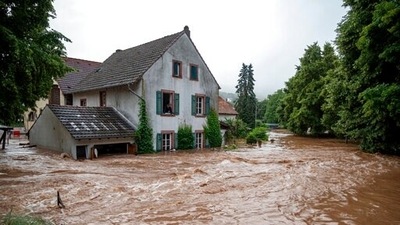 Houses are submerged on the overflowed river banks in Erdorf, Germany, as the village was flooded on Thursday, July 15, 2021. (AP) Houses are submerged on the overflowed river banks in Erdorf, Germany, as the village was flooded on Thursday, July 15, 2021. (AP)