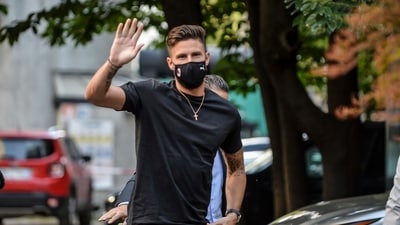 Newly hired AC Milan soccer club player Olivier Giroud arrives at a medical center in Milan. (AP) Newly hired AC Milan soccer club player Olivier Giroud arrives at a medical center in Milan. (AP)