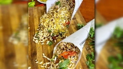 Jhalmuri: This delicious chatpata snack made with puffed rice, onions, tomatoes, chillies, nuts and spices is found in every corner of the city. (Instagram/@thecolorcradle) Jhalmuri: This delicious chatpata snack made with puffed rice, onions, tomatoes, chillies, nuts and spices is found in every corner of the city. (Instagram/@thecolorcradle)