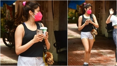 Janhvi Kapoor wore a simple yet trendy black and white attire for her workout. She donned a black tank top and teamed it with a pair of white shorts and a pink face mask. She tied her locks in a high ponytail with a hot pink scrunchy. (Varinder Chawla) Janhvi Kapoor wore a simple yet trendy black and white attire for her workout. She donned a black tank top and teamed it with a pair of white shorts and a pink face mask. She tied her locks in a high ponytail with a hot pink scrunchy. (Varinder Chawla)