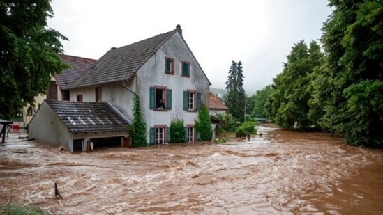 Houses are submerged on the overflowed river banks in Erdorf, Germany, as the village was flooded on Thursday, July 15, 2021. (AP)