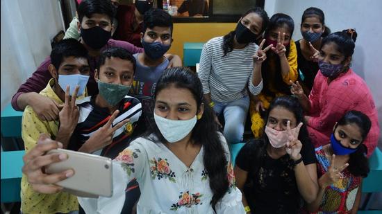 Students flash a victory sign while taking a selfie after the SSC Exam results were declared online, in Maharashtra. (Praful Gangurde / HT Photo)