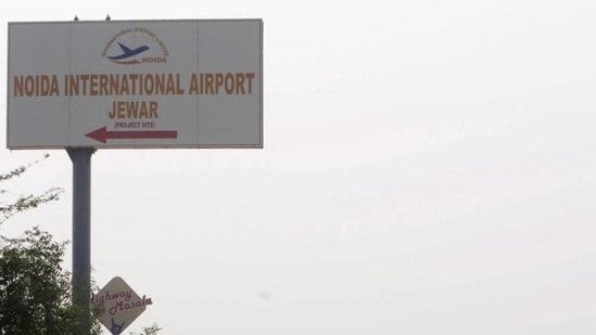 A signboard points towards the Noida International Jewar Airport (Sunil Ghosh/HT Photo).