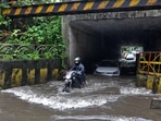 Around 15 people were killed and several injured after they were trapped under houses that collapsed due to landslides. BMC's disaster management cell said that 12 people were brought dead to the Rajawadi Hospital and two were discharged after being treated for their injuries. In a separate incident, three people died and two were injured after houses collapsed in the Vikhroli area.(Vijay Bate/HT Photo)