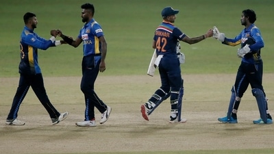 India's Shikhar Dhawan with Sri Lanka players after India won the match. (REUTERS)