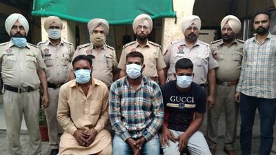 The accused in police custody of Doraha in Ludhiana on Sunday. (HT PHOTO)