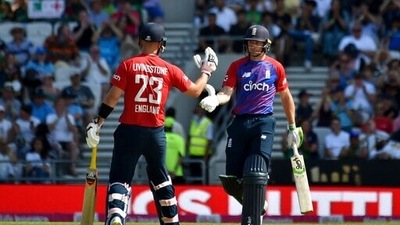 England's Jos Buttler celebrates with batting partner Liam Livingstone after scoring fifty runs during the 2nd T20I against Pakistan (AP) England's Jos Buttler celebrates with batting partner Liam Livingstone after scoring fifty runs during the 2nd T20I against Pakistan (AP)