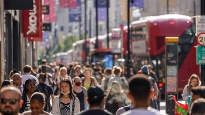 Pedestrians, some wearing face coverings due to Covid-19, walk past shops on Oxford Street in central London on June 7, 2021 (Image used only for representative purpose/AFP)