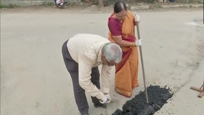 Gangadhar took the initiative after his repeated requests to fix the holes were overlooked by the authorities. (ANI) Gangadhar took the initiative after his repeated requests to fix the holes were overlooked by the authorities. (ANI)