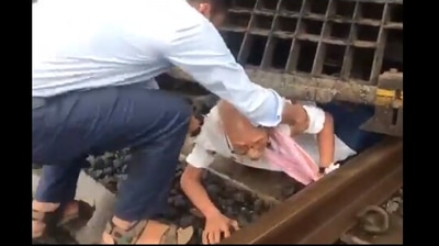 The image shows the elderly man being taken out after the loco pilots halted the Mumbai-Varanasi train with emergency brakes. (Twitter/@RailMinIndia) The image shows the elderly man being taken out after the loco pilots halted the Mumbai-Varanasi train with emergency brakes. (Twitter/@RailMinIndia)