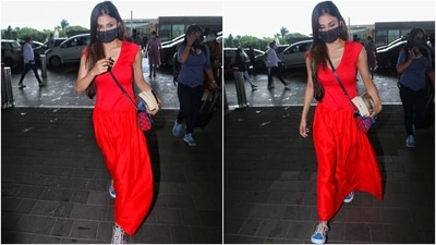 Mouni wore a bright red V neck midi with short sleeves. The ensemble featured elastic detail on the waistline to cinch it together and provide a fit-and-flare silhouette. (Varinder Chawla) Mouni wore a bright red V neck midi with short sleeves. The ensemble featured elastic detail on the waistline to cinch it together and provide a fit-and-flare silhouette. (Varinder Chawla)