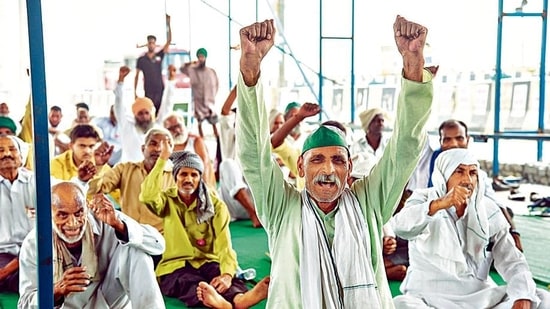 Farmers shout slogans during their protest against the three farms laws, at the Ghazipur border, in Delhi. (ANI Photo) Farmers shout slogans during their protest against the three farms laws, at the Ghazipur border, in Delhi. (ANI Photo)