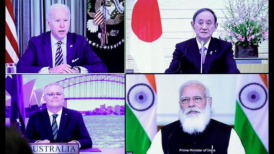 A monitor displaying a virtual meeting with US President Joe Biden, Australia's Prime Minister Scott Morrison, Japan's Prime Minister Yoshihide Suga and India's Prime Minister Narendra Modi during the virtual Quadrilateral Security Dialogue meeting, March 12, 2021 (POOL/AFP via Getty Images)