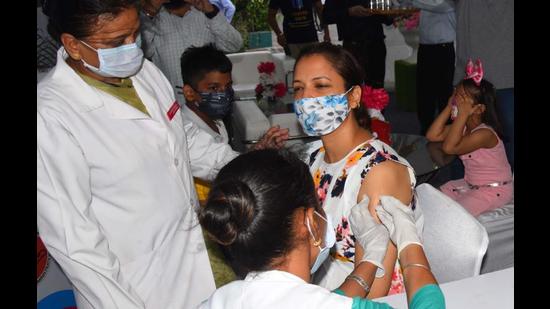 A woman getting vaccinated at the vaccination sewa centre in Chandigarh. (HT Photo)
